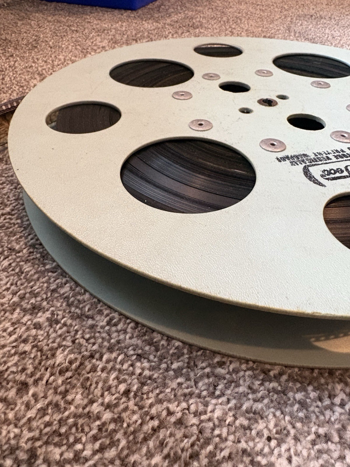 VINTAGE – 15 INCH REWIND FILM REEL – WITH MYSTERY FILM STILL ON – USED