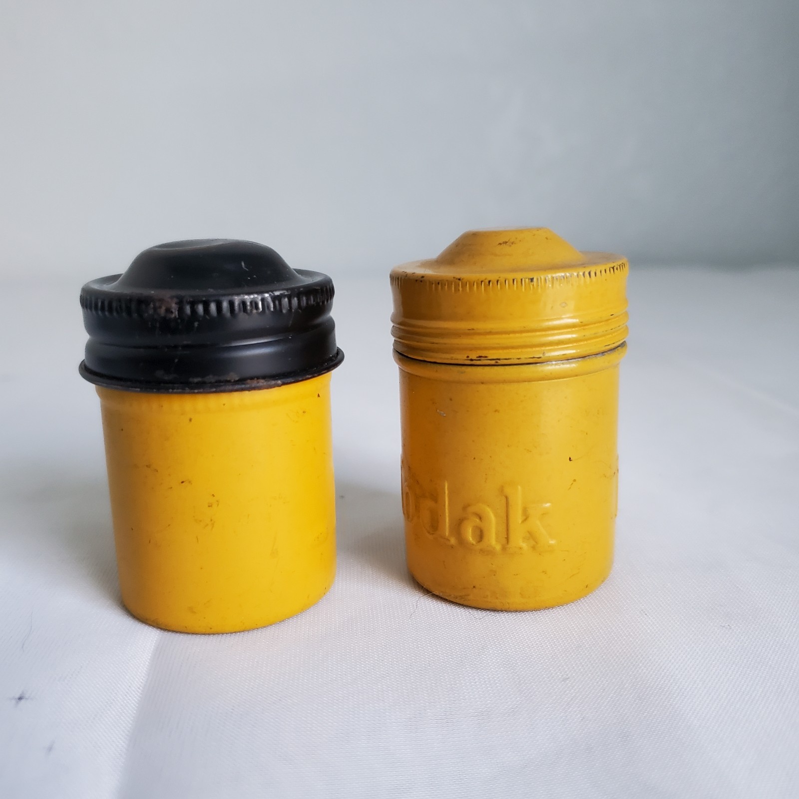 Lot of 2 Kodak Black Yellow Embossed Metal Film Roll Containers