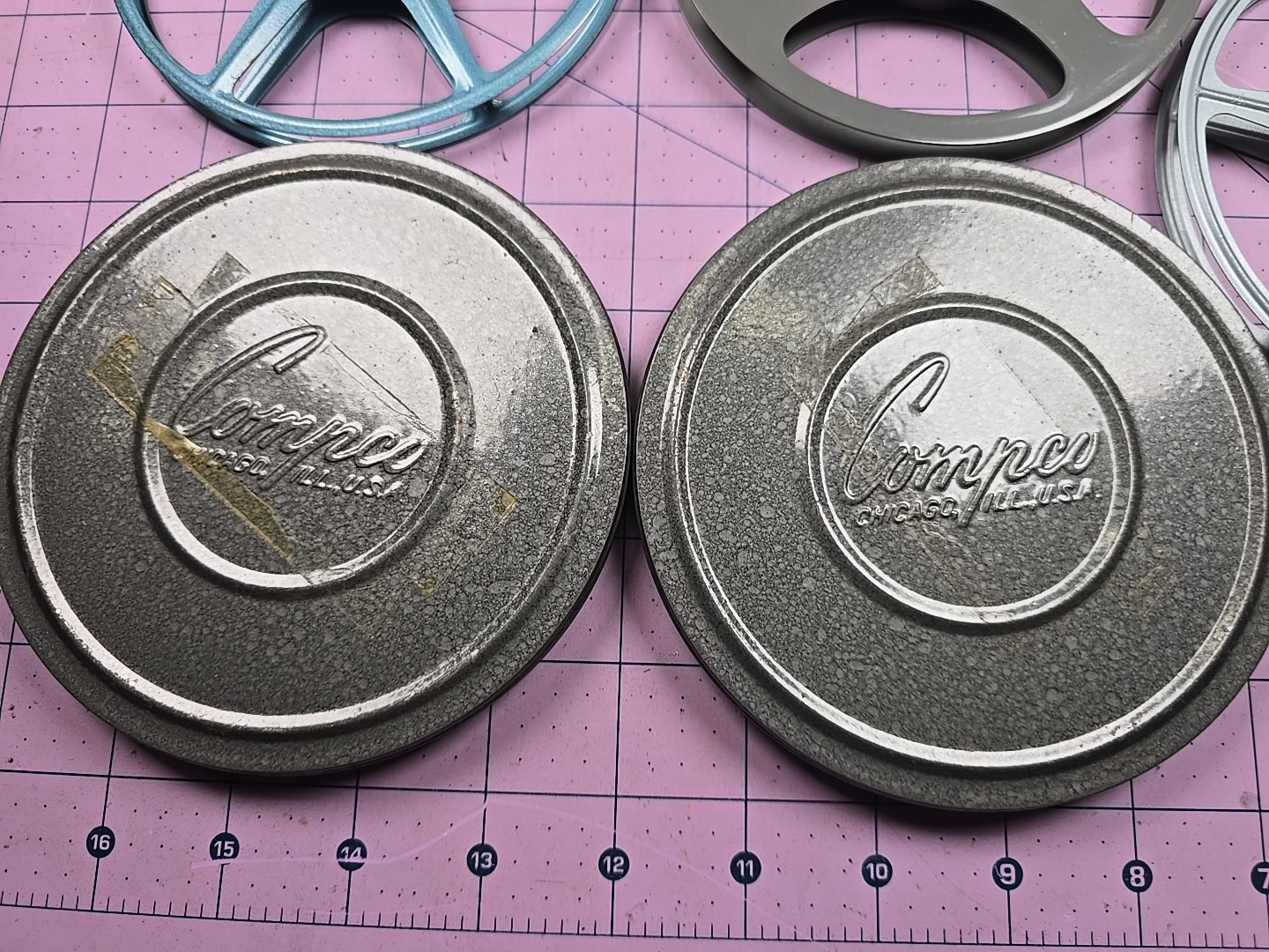 3 – 5″ 200Ft movie reels, 2 cans and carrying case – Comco and Scherer