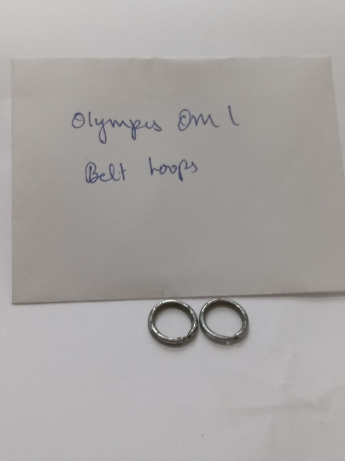 Olympus OM 1 Black Camera Belt/ Strap Loops Original Used Spare Part.