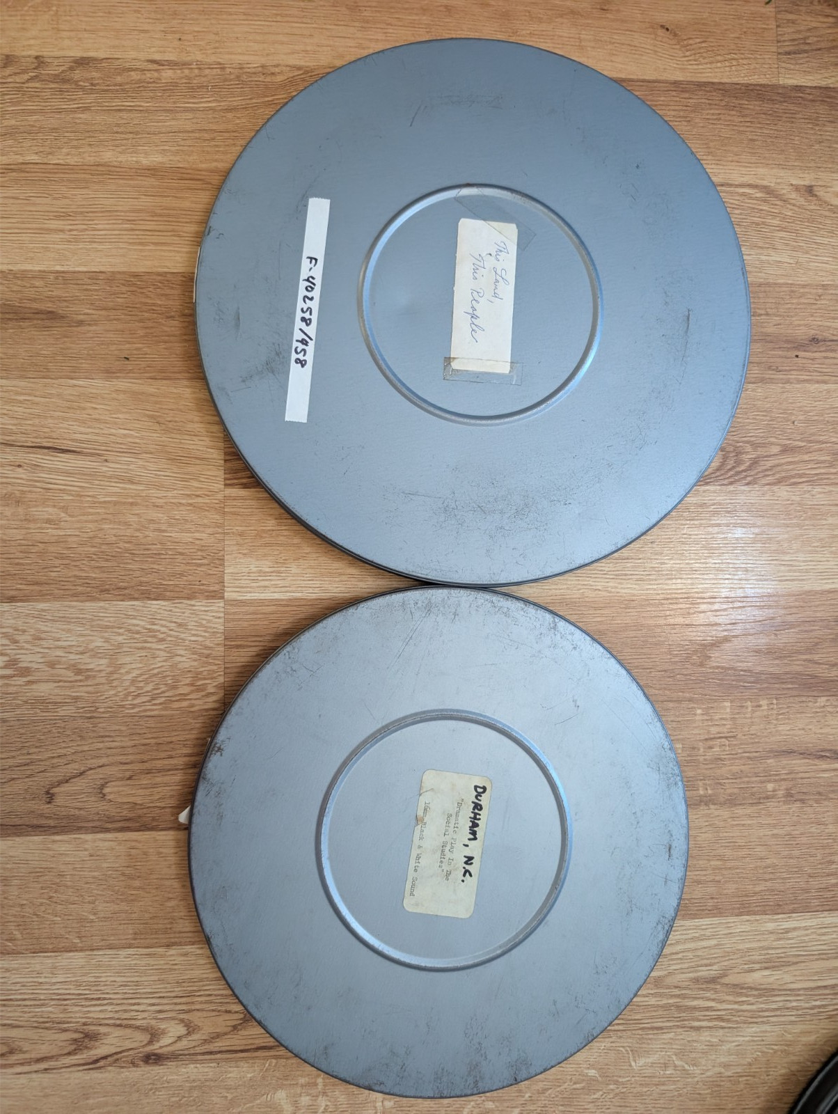 2 MPE 16mm Metal Film Reel 10 3/4 & 12 1/2 Canisters Bluish Tint