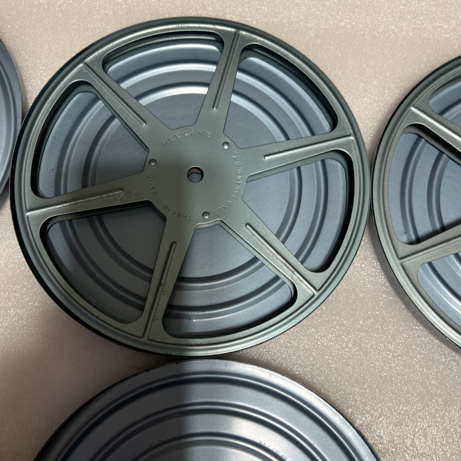 Reelane Thread-O-Matic 7” Film Reel with Canister Lot