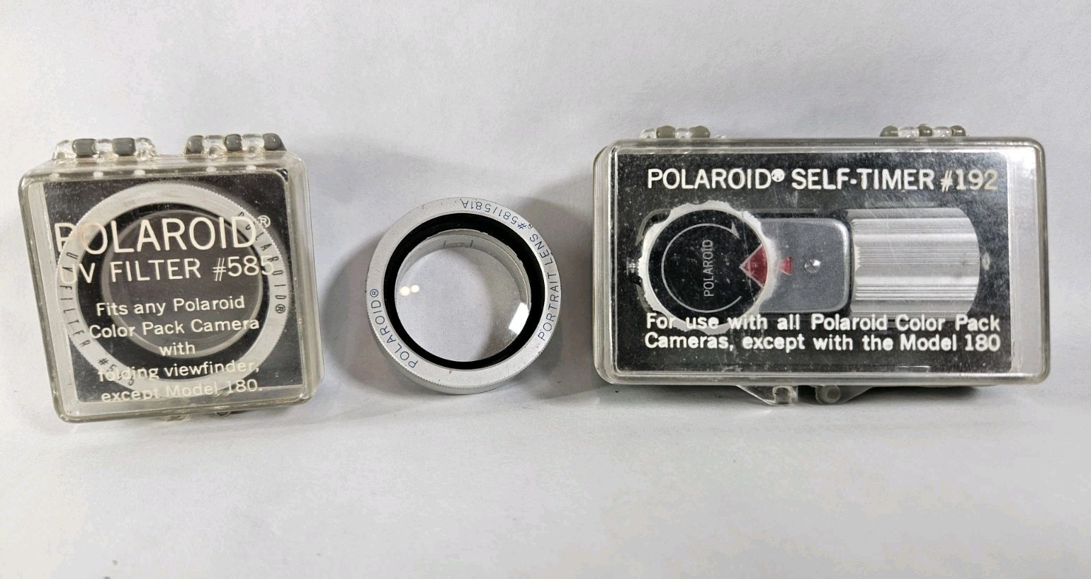 Polaroid Self-timer #192, Polaroid UV Filter #585, Portrait Lens #581 A