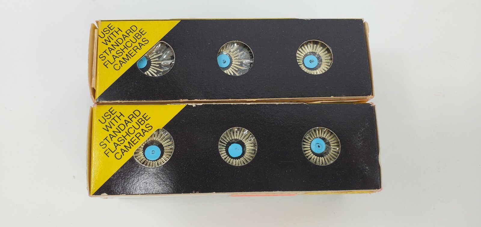 4 Camera Flash Cubes, 3 Boxes of Sylvania Blue Dot, 1 Box of Norelco NOS Bulbs