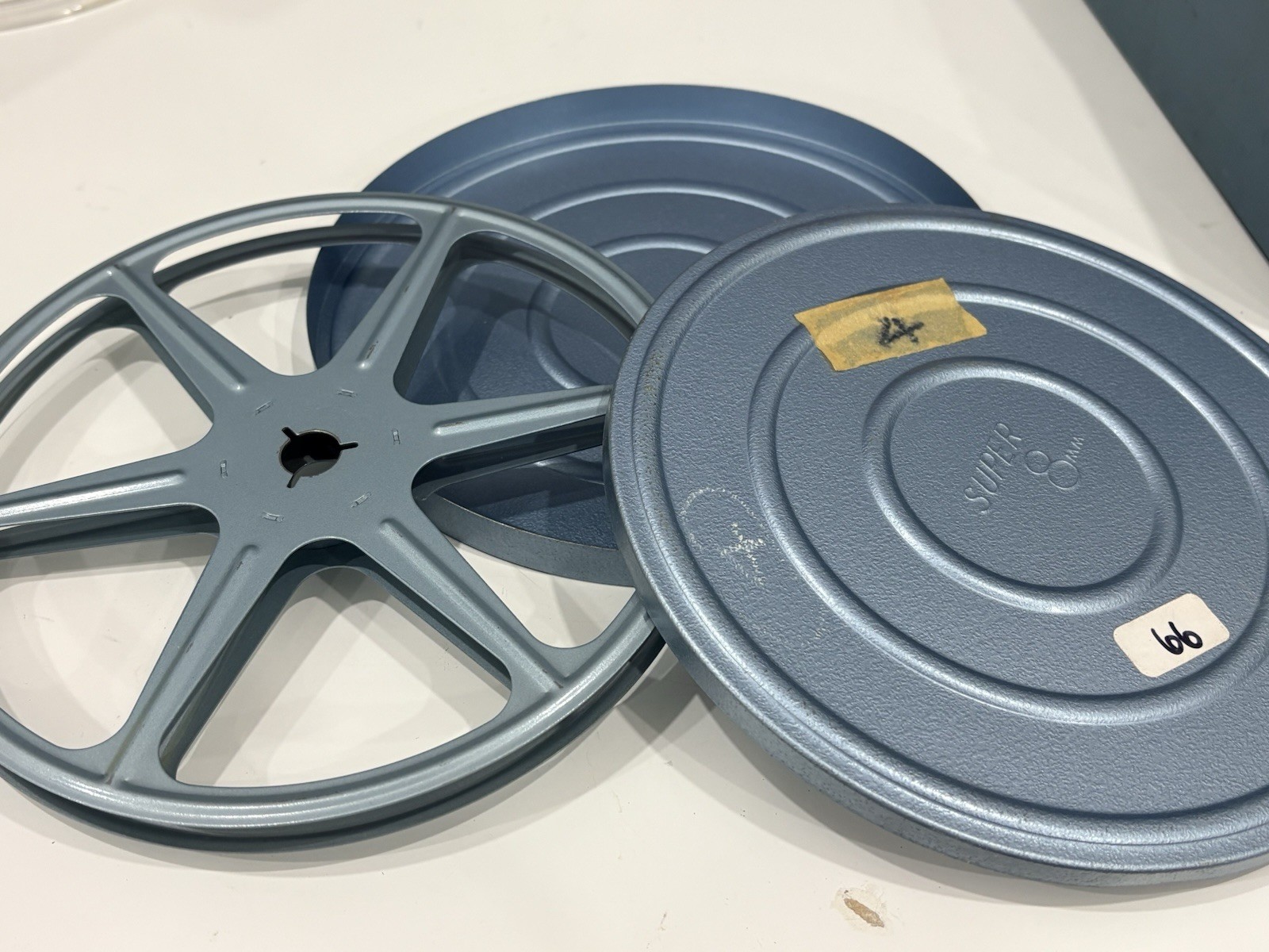 13 vintage 8mm film reels with 12 canisters and carrying case. No Film.