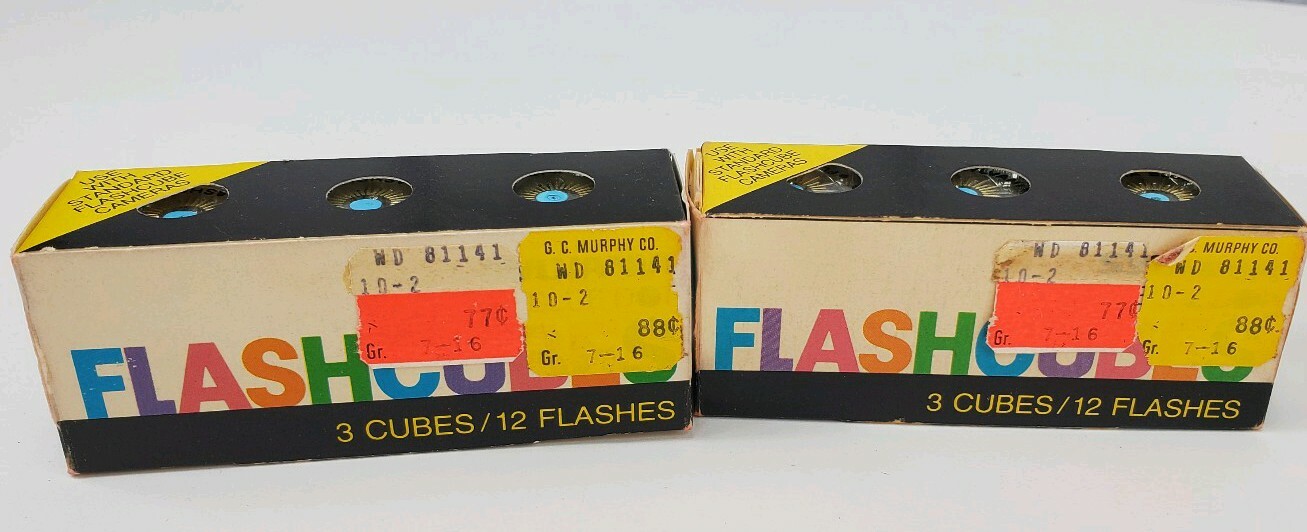 4 Camera Flash Cubes, 3 Boxes of Sylvania Blue Dot, 1 Box of Norelco NOS Bulbs