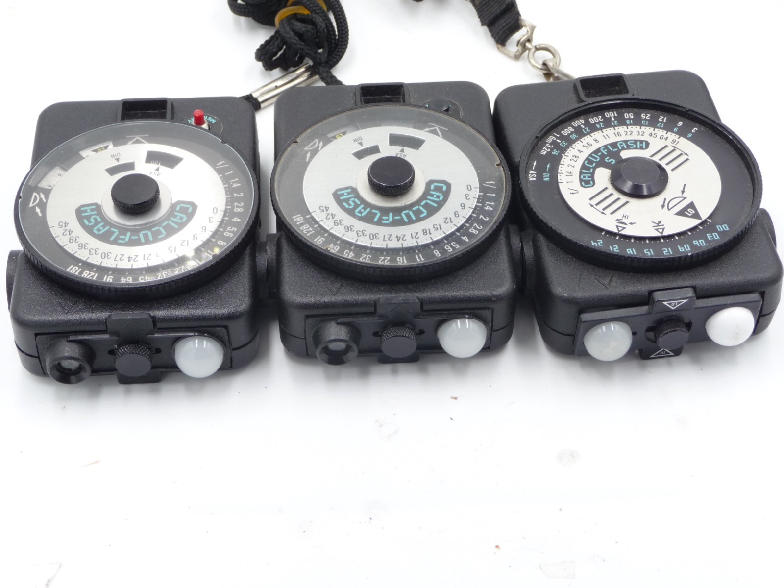 Lot of 3 Calcu-Flash meters, with manuals and one case, extra domes