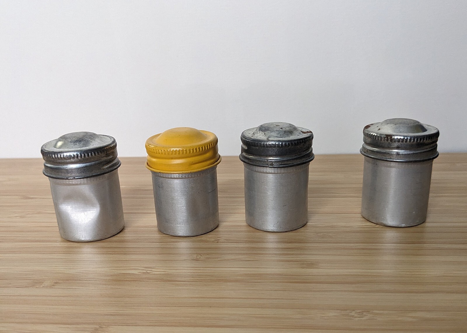 Four Vintage 35mm aluminum film canisters unbranded W/ metal top