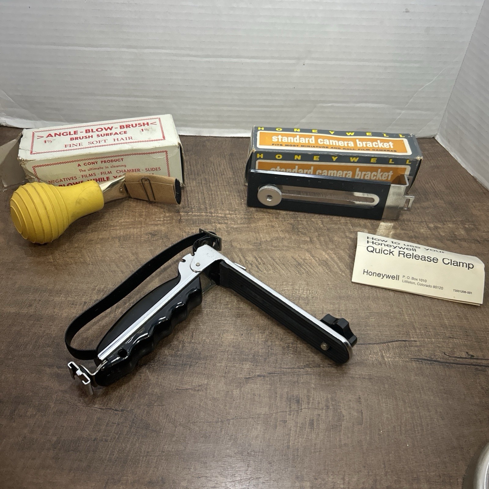 Lot of 3 Vintage camera accessories, 2 camera brackets & 1 angle blow brush