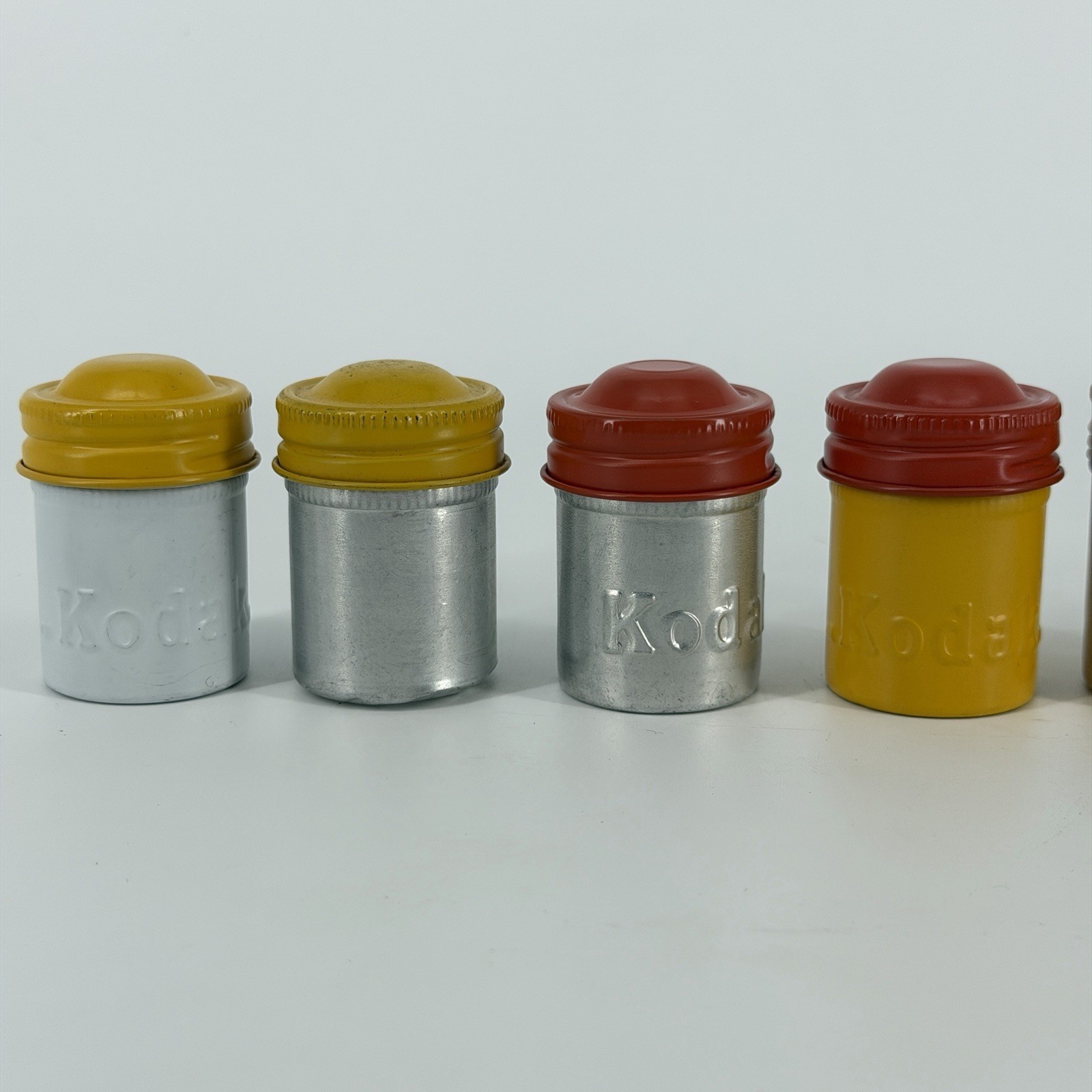 Lot of 7 Vintage Metal Kodak 35mm Film Canisters Yellow, Red, Silver