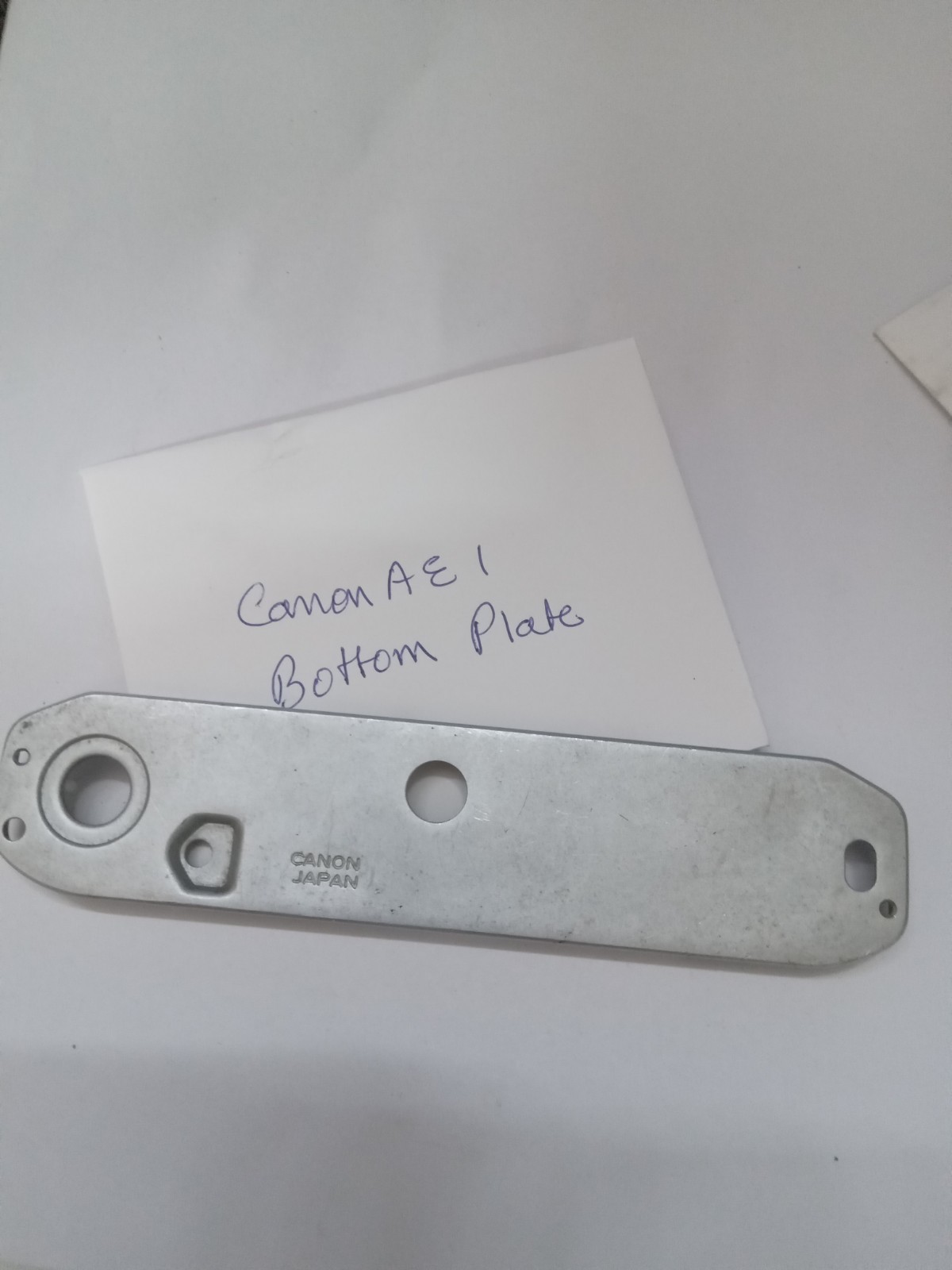 Canon AE 1 Film SLR Camera Bottom Plate Original Used Part Good