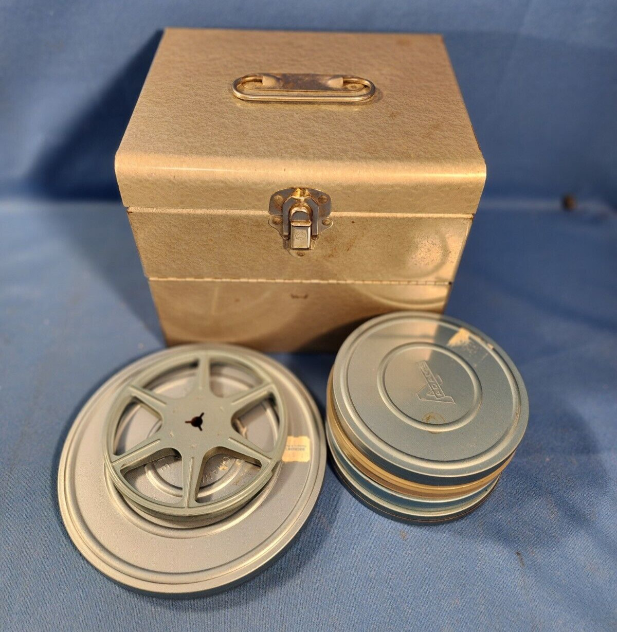 VINTAGE FILM CANS, REELS & LOGAN 12 SLOT CHEST – BLUE GRAY COLOR