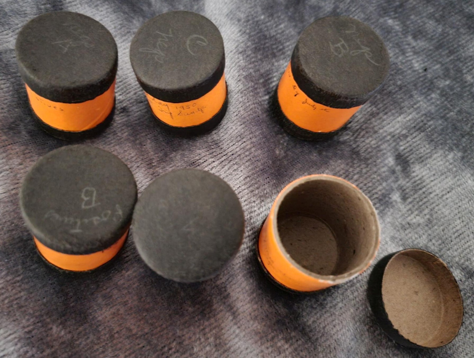 Vintage 35 mm film canisters-leather, metal and paper