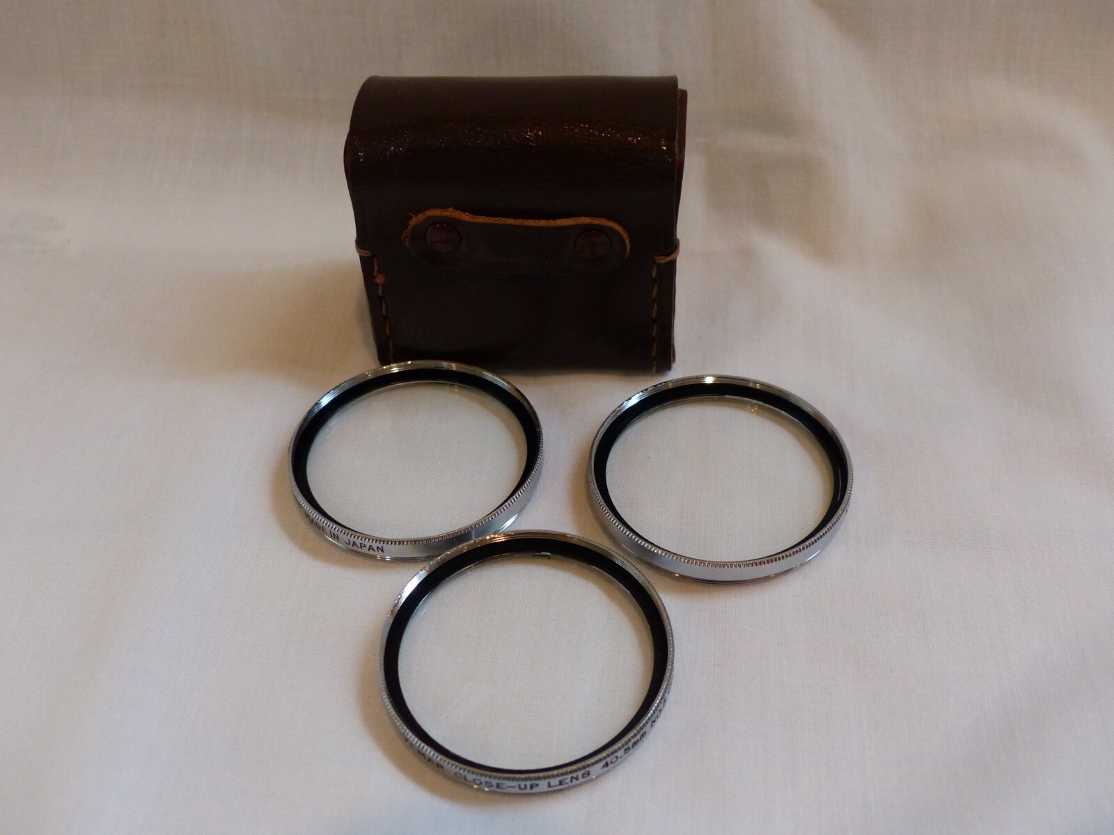 Vintage Vemar 40.5 mm closeup filters in leather case, No. 1, 2, and 3