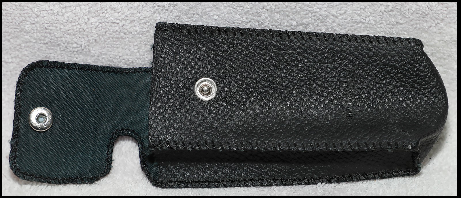 Empty pouch with Minolta logo. I think it’s for a Minolta 16mm camera. Read