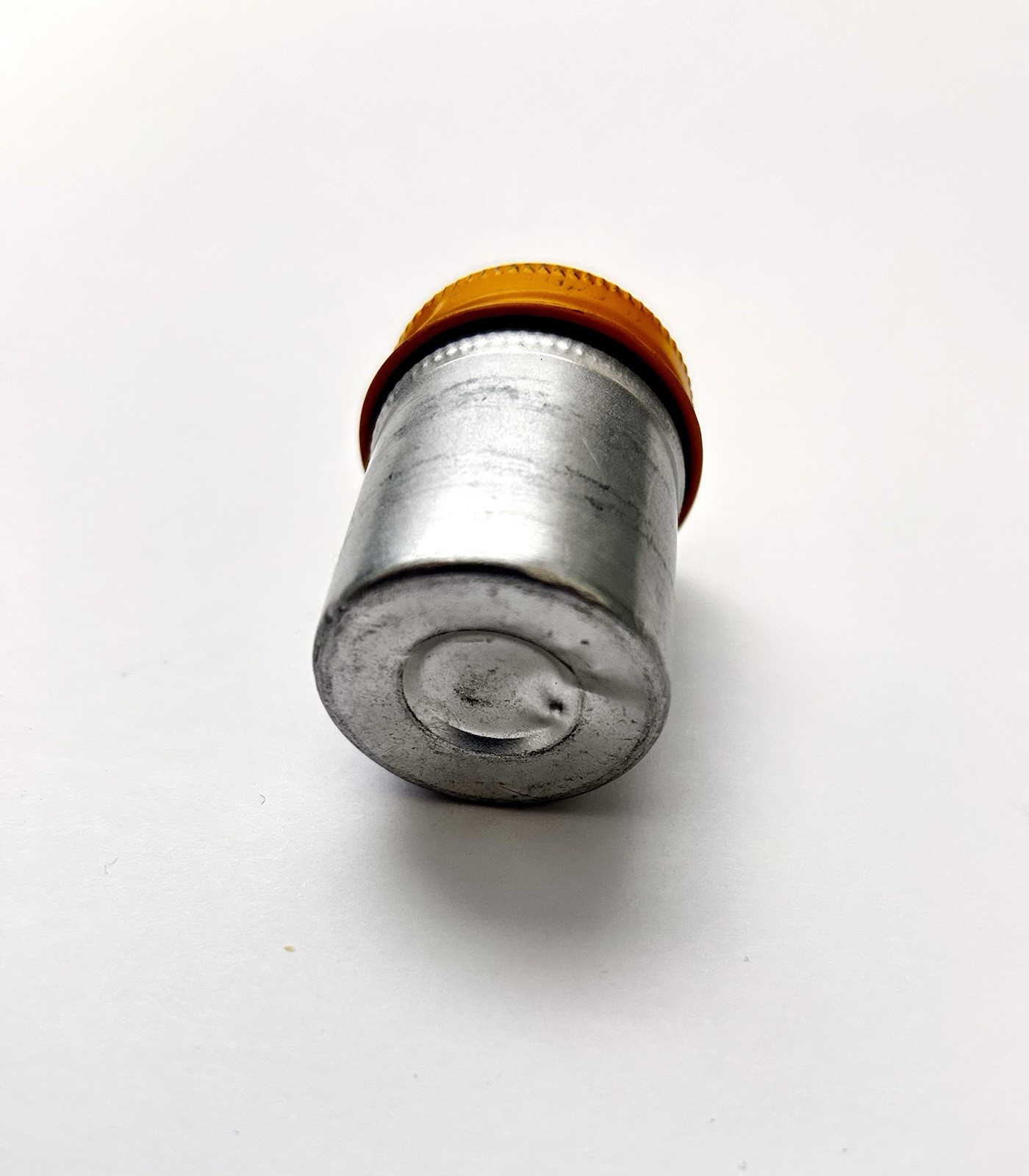 Classic Vintage 35mm aluminum film canister unbranded with metal yellow top cap