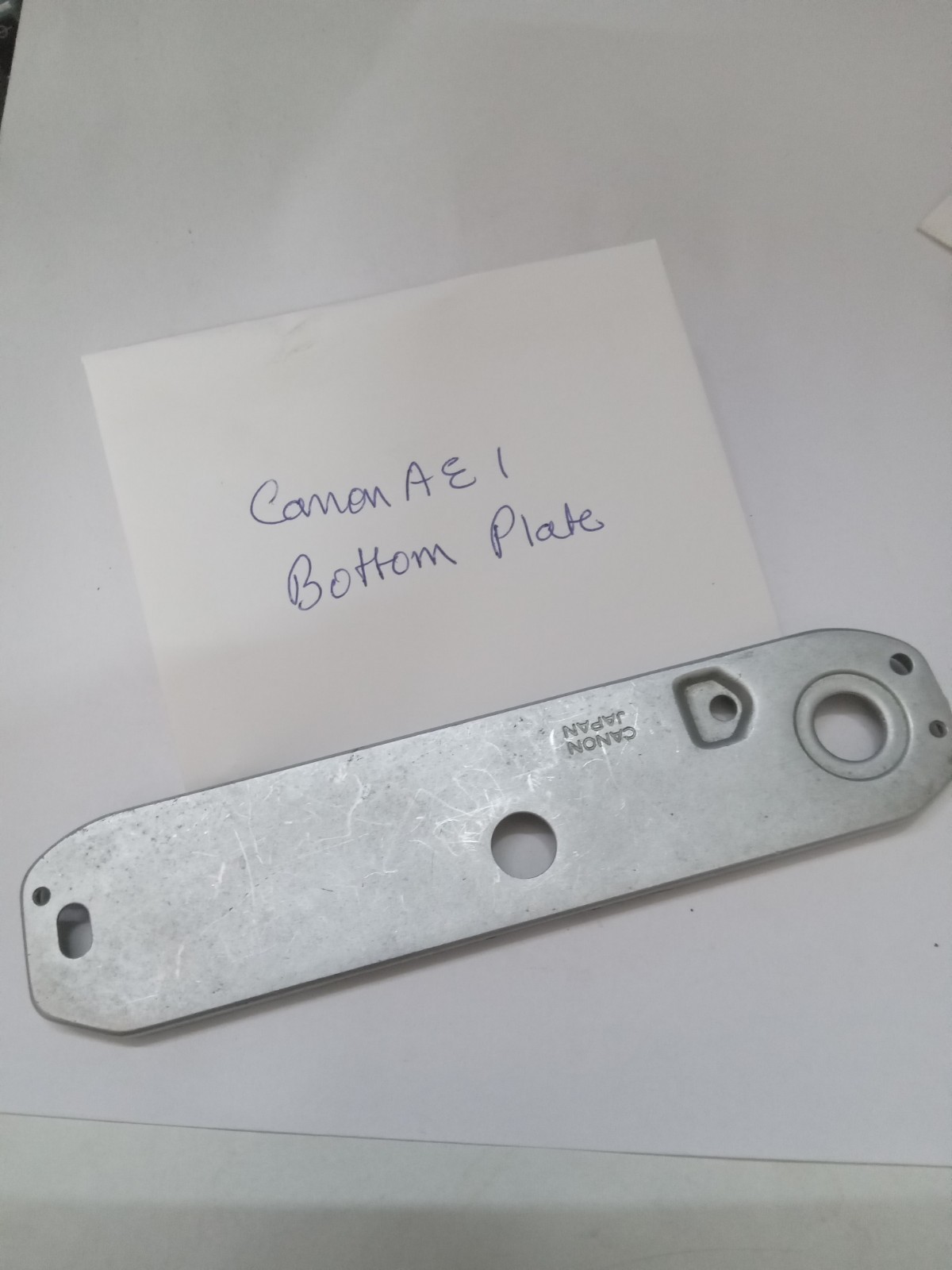 Canon AE 1 Film SLR Camera Bottom Plate Original Used Part Good