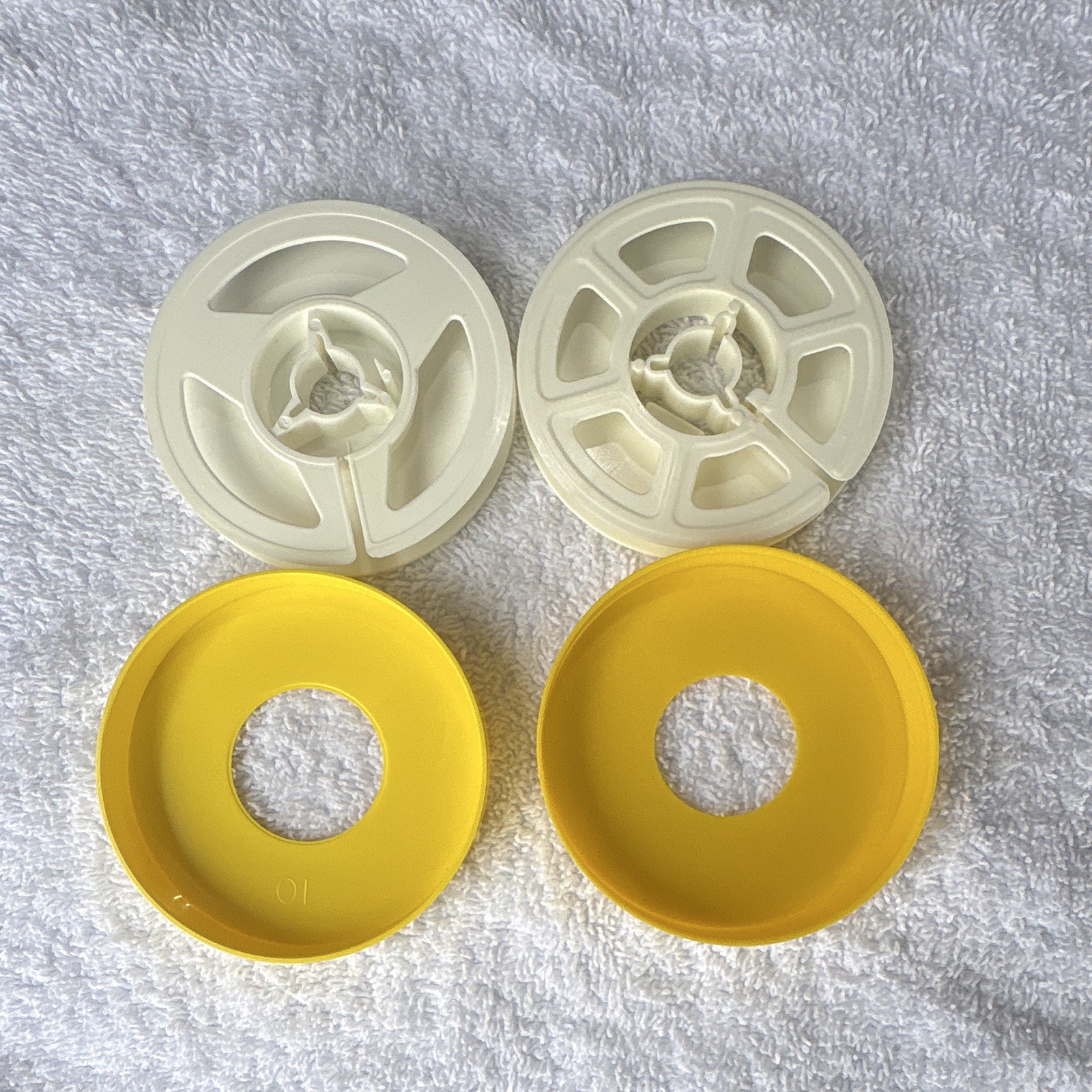 8mm film reels. Lot of 16. Used. Plastic cases For 8 mm reel to reel Movies.
