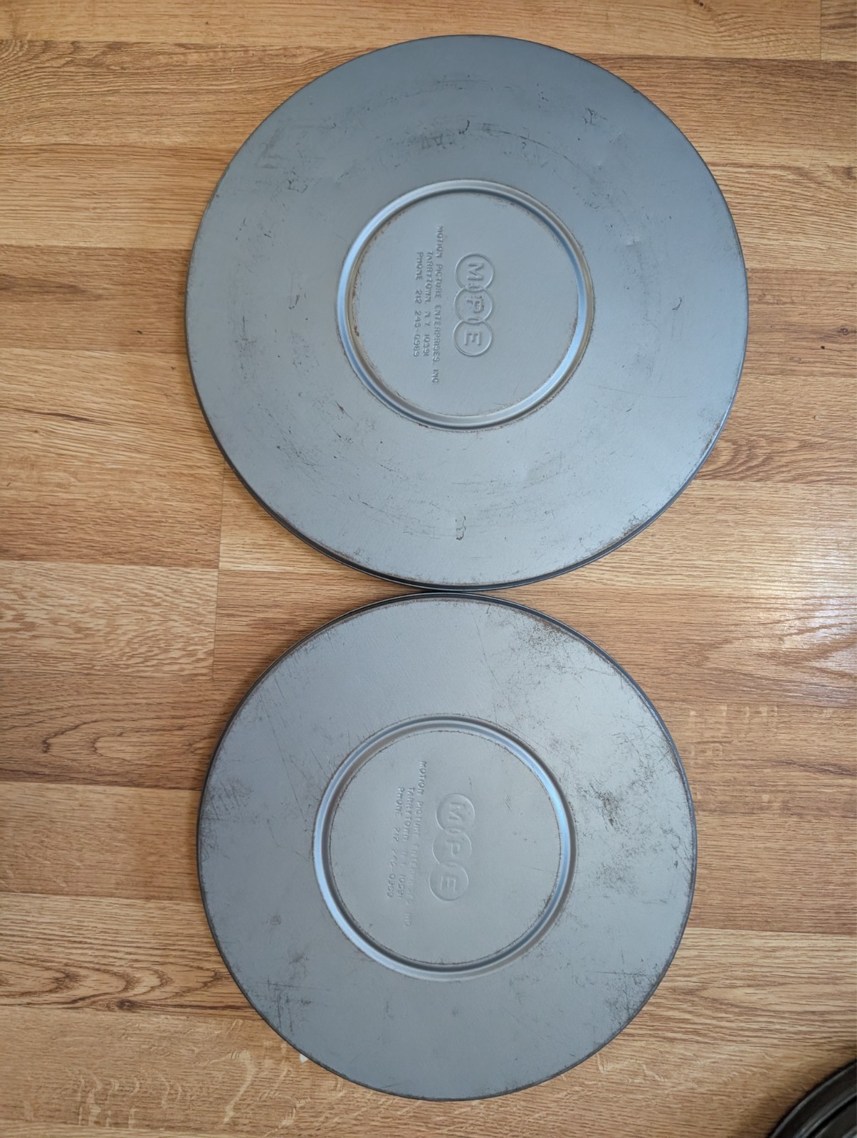 2 MPE 16mm Metal Film Reel 10 3/4 & 12 1/2 Canisters Bluish Tint