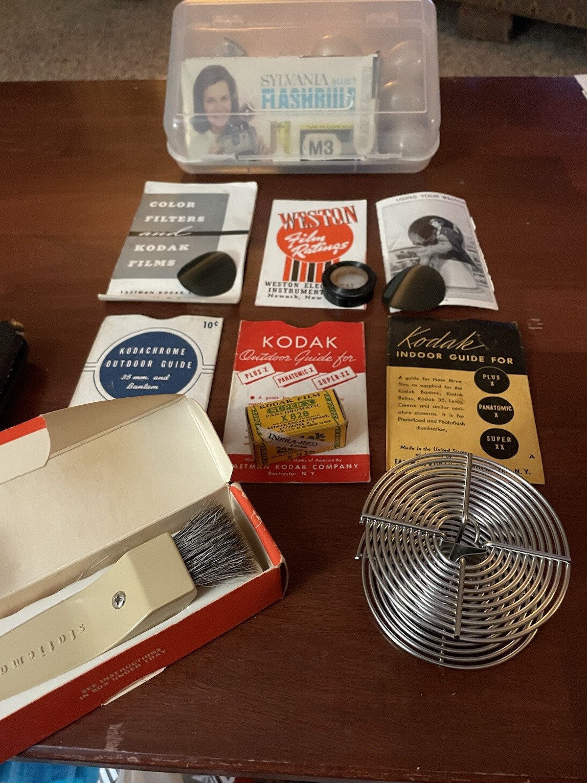 Assorted photography accessories flashbulbs anti-magnetic brush and film ring