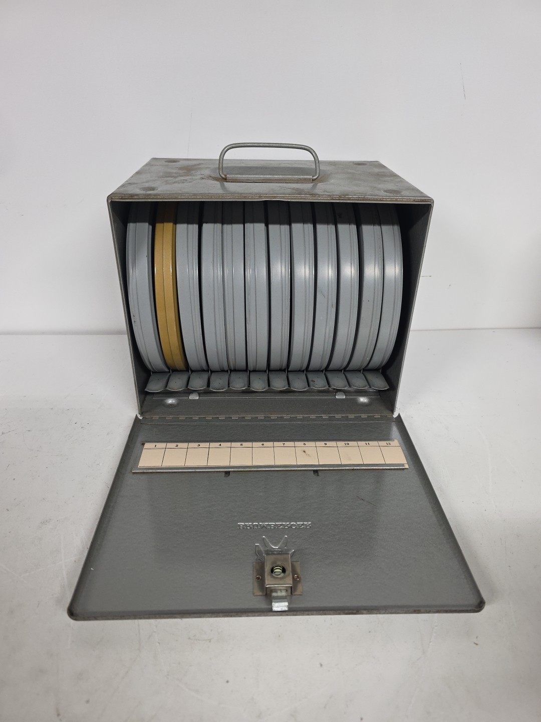 Brumberger Reel/Reel Metal Storage Case With Pop Out Tabs & 12 Empty Canisters