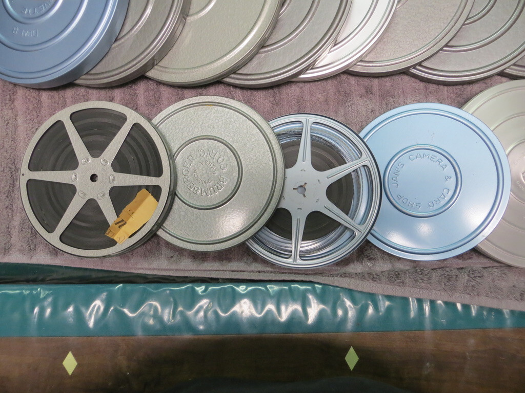 Brumberger 8mm reel case W/ 12 mint take up reels & vintage films
