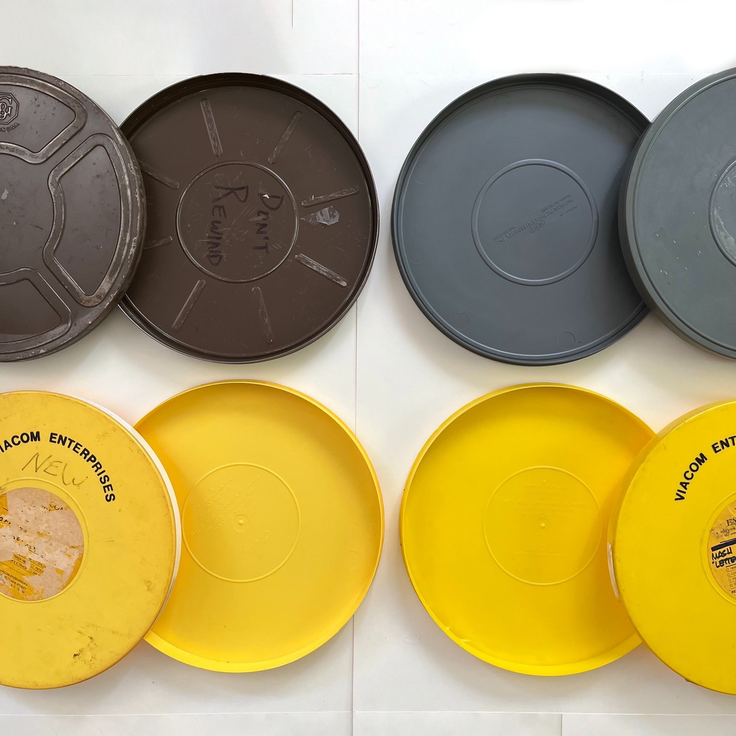 Assorted empty 1200′ 16mm Film Reels (3) and Canisters (4) incl. Fox / M*A*S*H