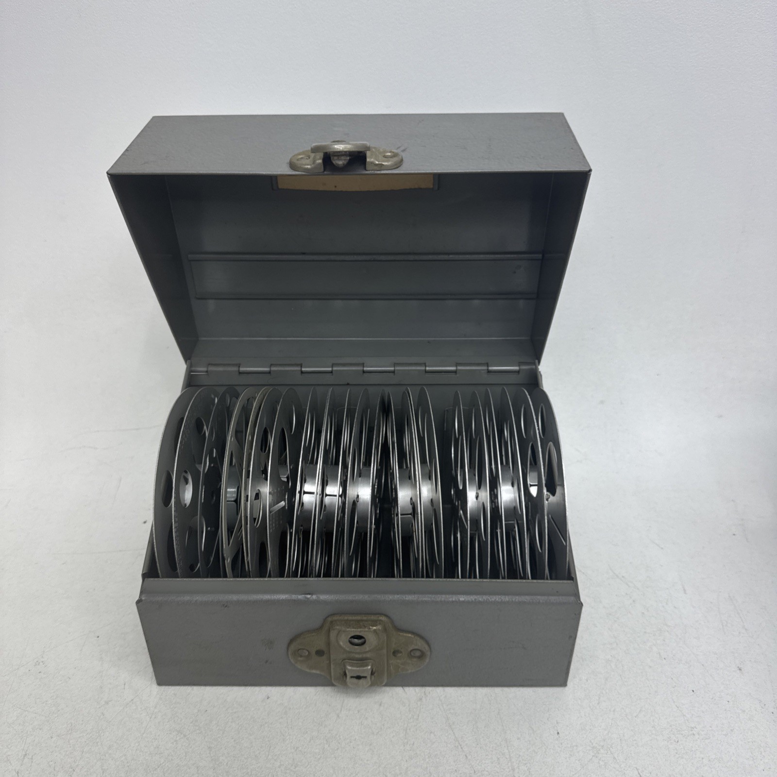 Brumberger Reel/Reel Metal Storage Case With 12 Empty Canisters