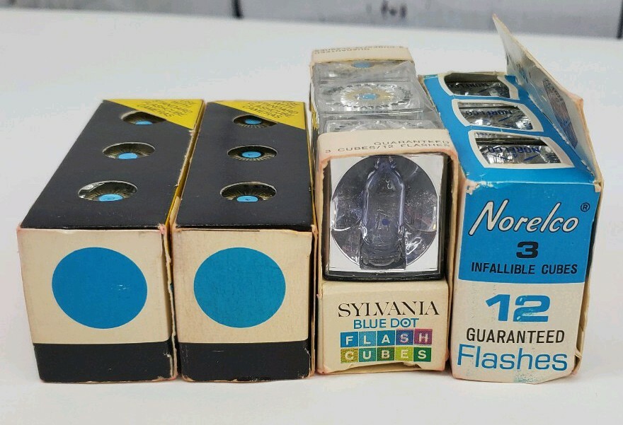 4 Camera Flash Cubes, 3 Boxes of Sylvania Blue Dot, 1 Box of Norelco NOS Bulbs