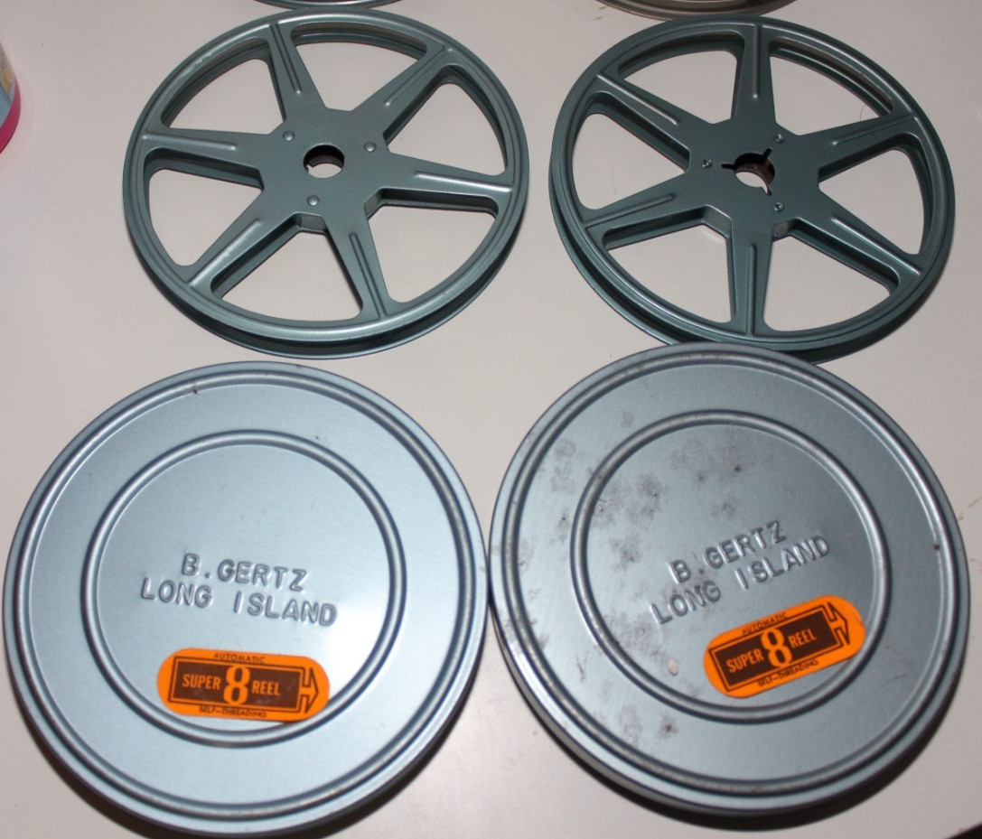 4 METAL SUPER 8 REELS WITH TINS HERALD SQUARE MACY’S W.T. GRANT B GERTZ COMPCO