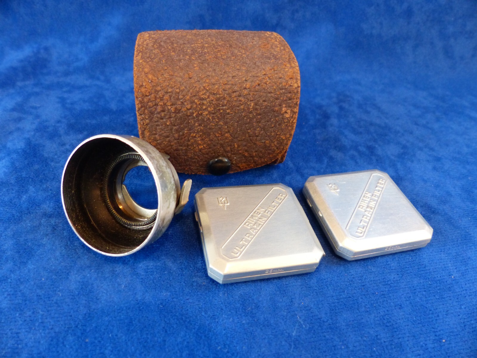 Vintage Riken 25 mm filters in metal cases+clamp-on lens hood in leather case