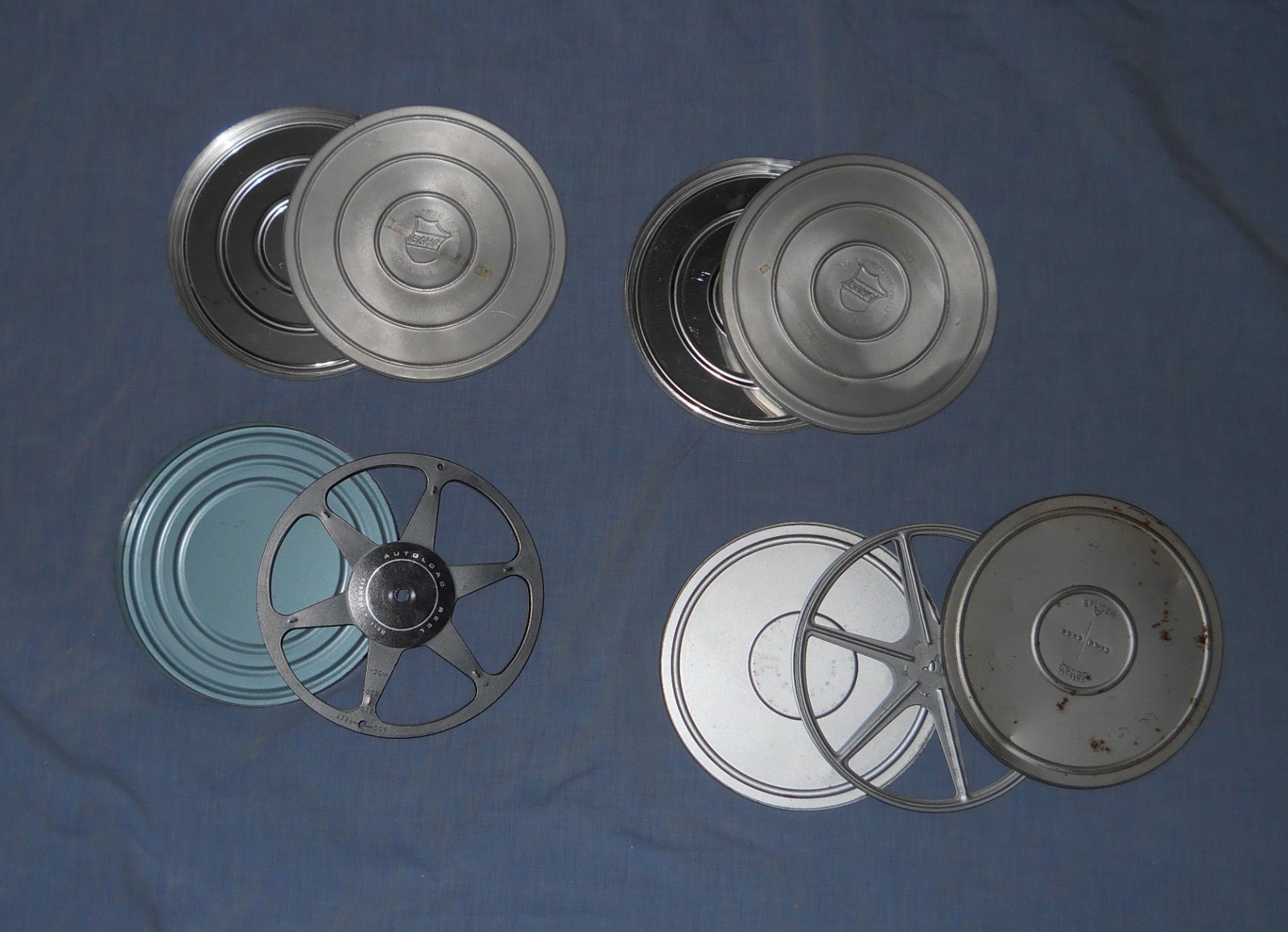 8mm film canisters, Three (2 Bell and Howell, no reels – one Kenco with Reel)