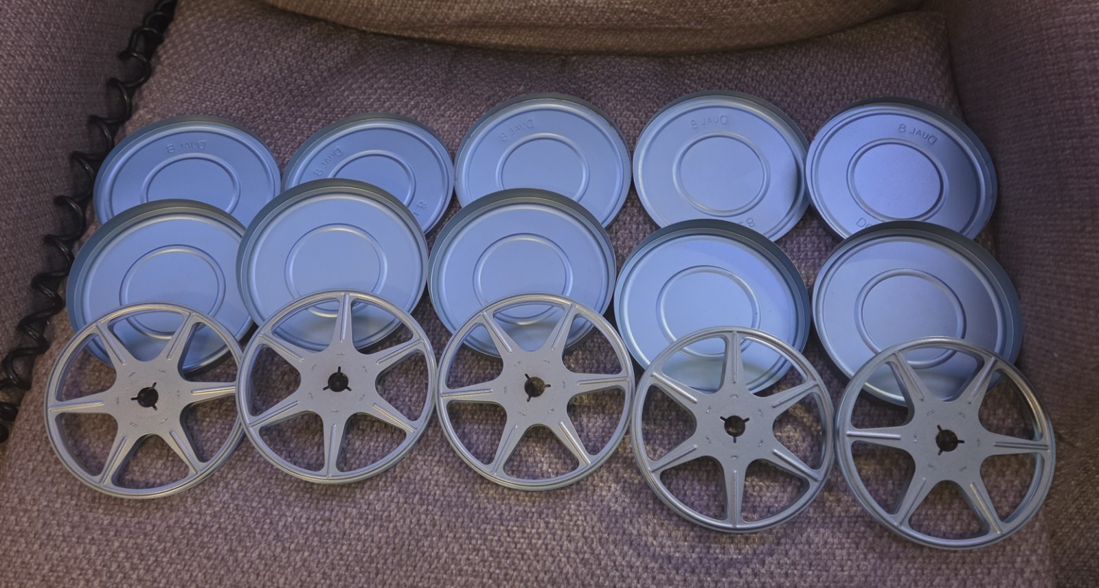 Five (5) Dual 8 Movie Reels with Metal Cans and Metal Storage Box – 5″ diameter