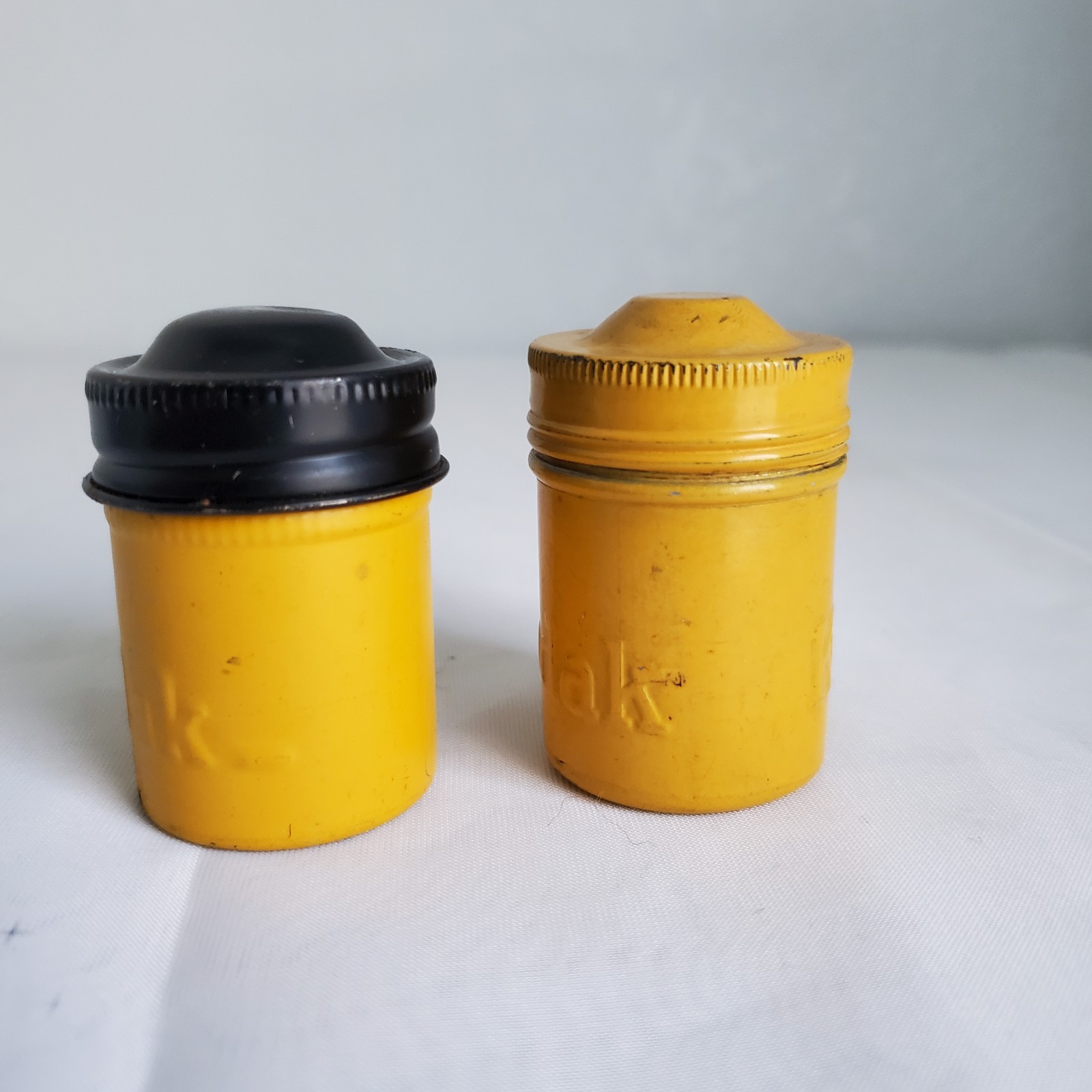 Lot of 2 Kodak Black Yellow Embossed Metal Film Roll Containers