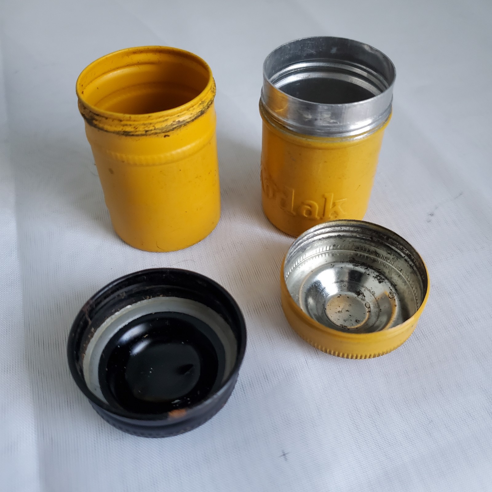 Lot of 2 Kodak Black Yellow Embossed Metal Film Roll Containers