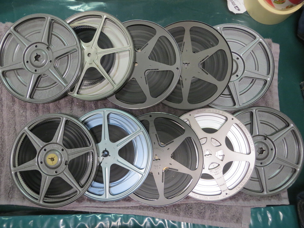 Brumberger 8mm reel case W/ 12 mint take up reels & vintage films