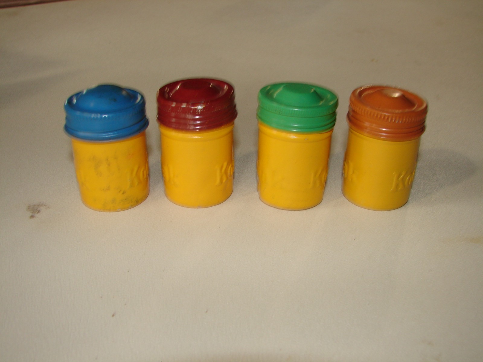 Kodak Metal Film Cannisters rare with Kodak embossed twice 4 yellow with diff co