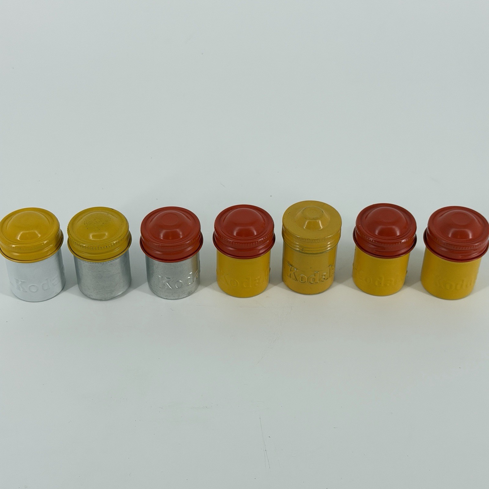 Lot of 7 Vintage Metal Kodak 35mm Film Canisters Yellow, Red, Silver