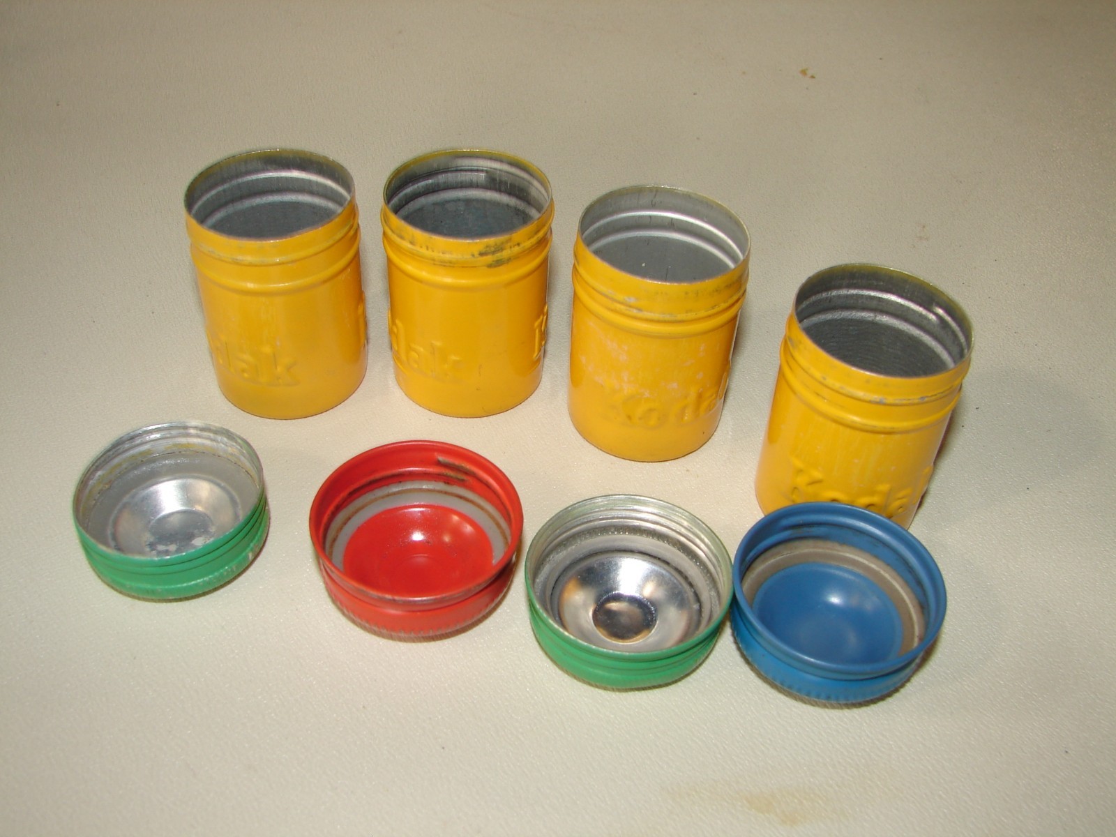 Kodak Metal Film Cannisters rare with Kodak embossed twice 4 yellow with diff co