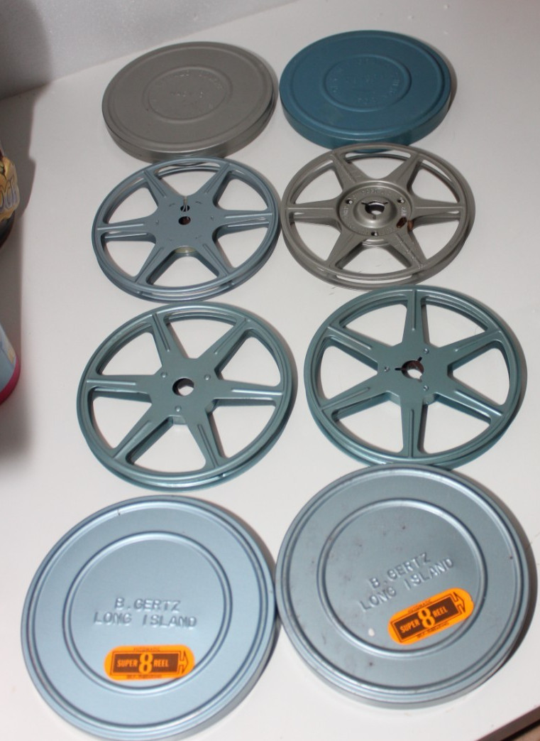 4 METAL SUPER 8 REELS WITH TINS HERALD SQUARE MACY’S W.T. GRANT B GERTZ COMPCO