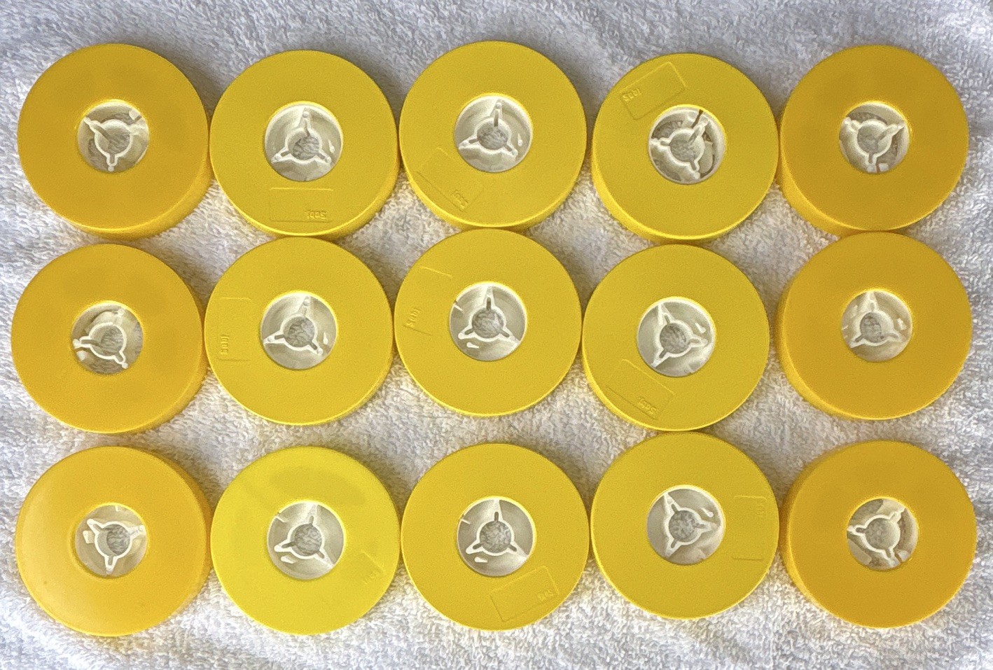 8mm film reels. Lot of 16. Used. Plastic cases For 8 mm reel to reel Movies.