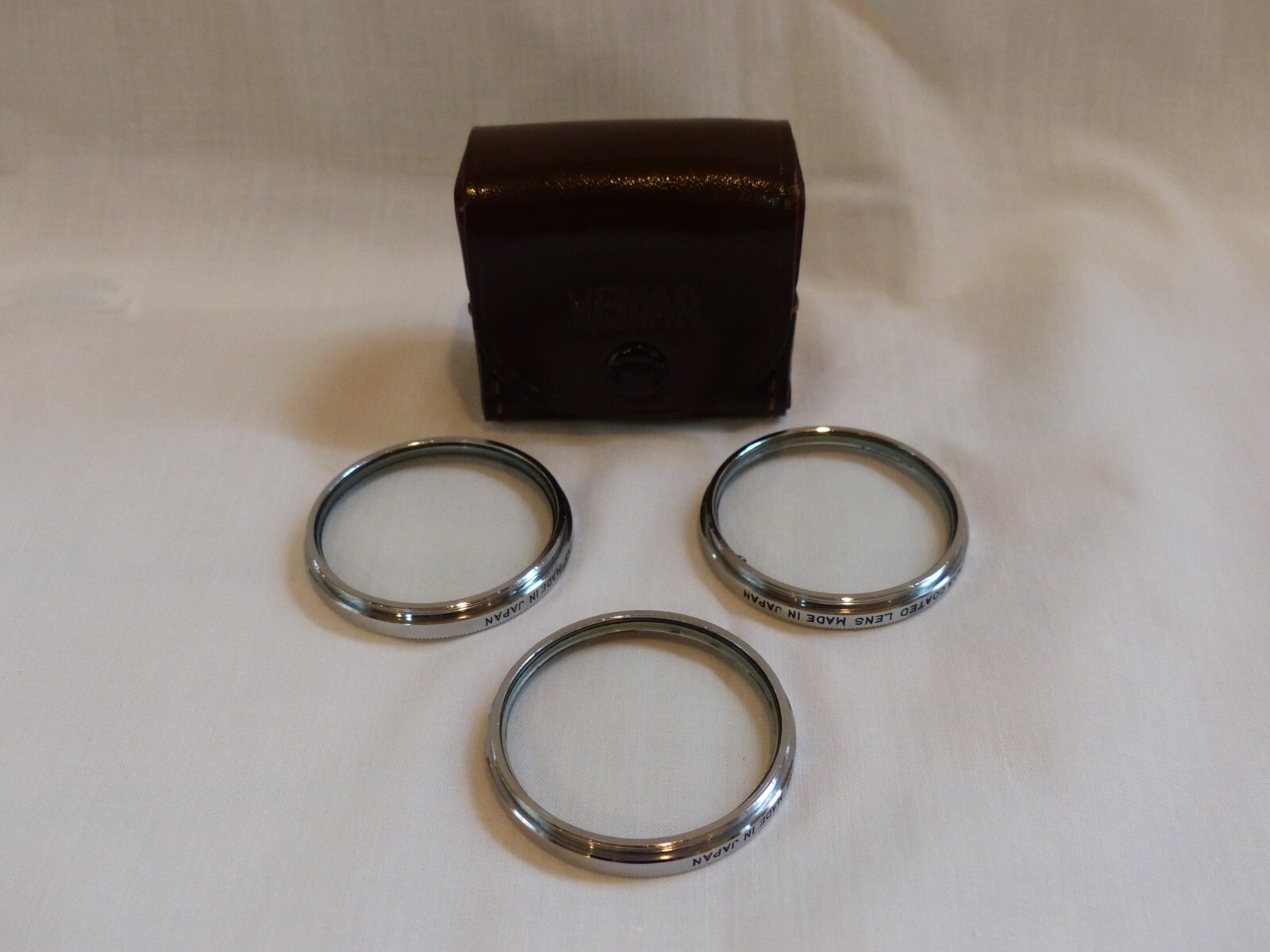 Vintage Vemar 40.5 mm closeup filters in leather case, No. 1, 2, and 3
