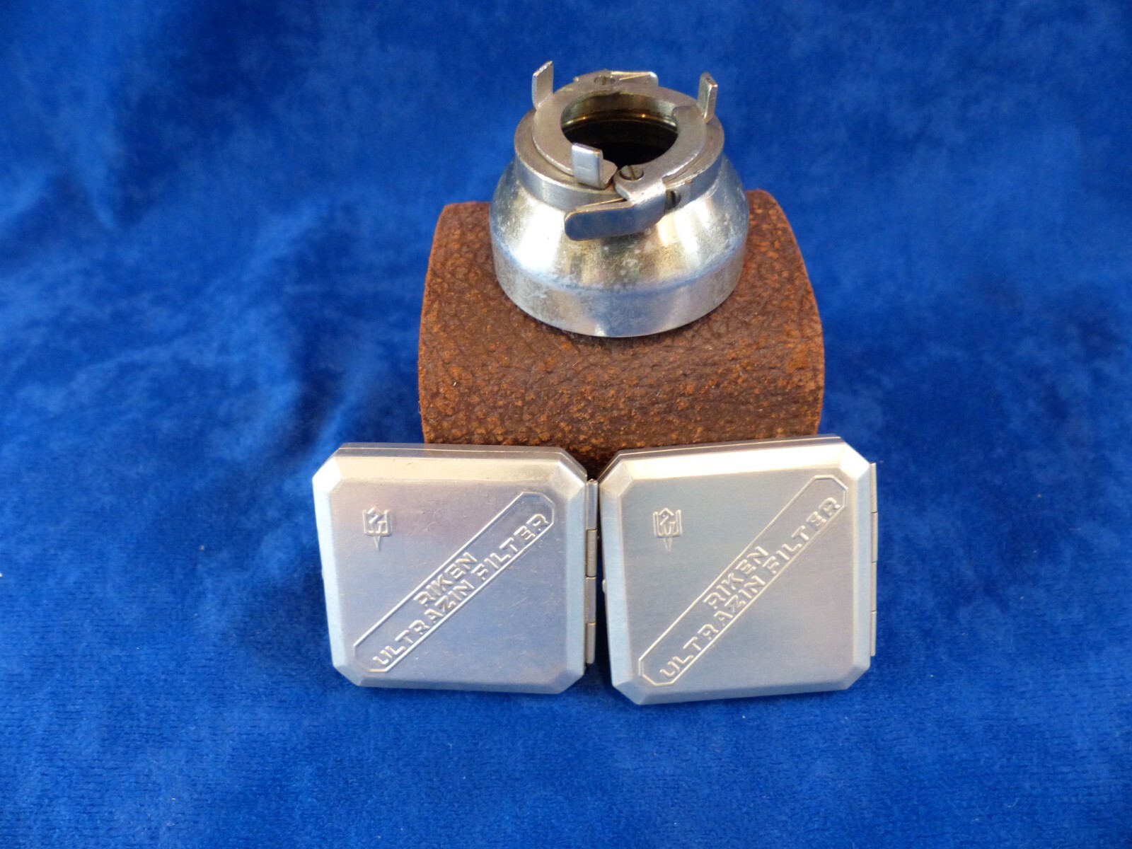 Vintage Riken 25 mm filters in metal cases+clamp-on lens hood in leather case