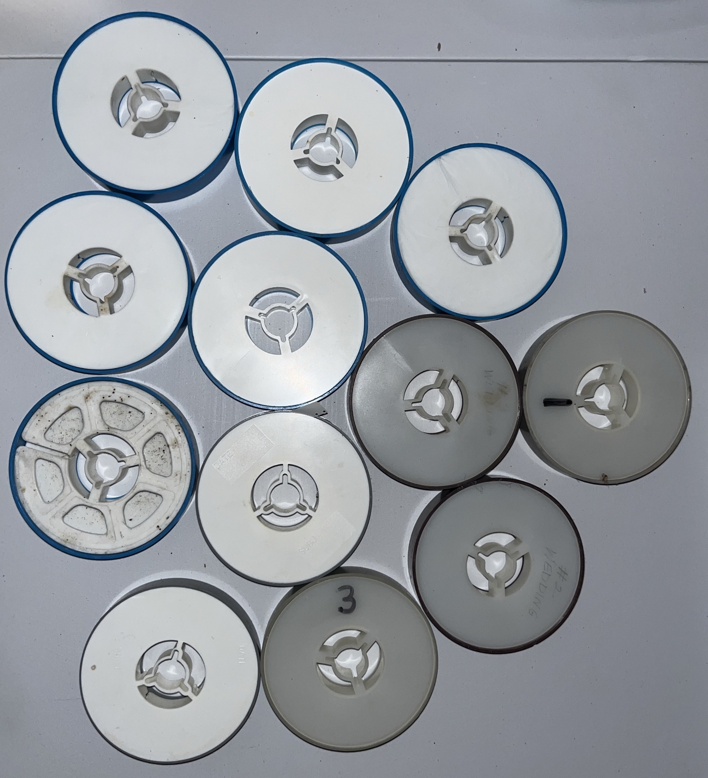 (12) 8mm Film Reels In Their Cases