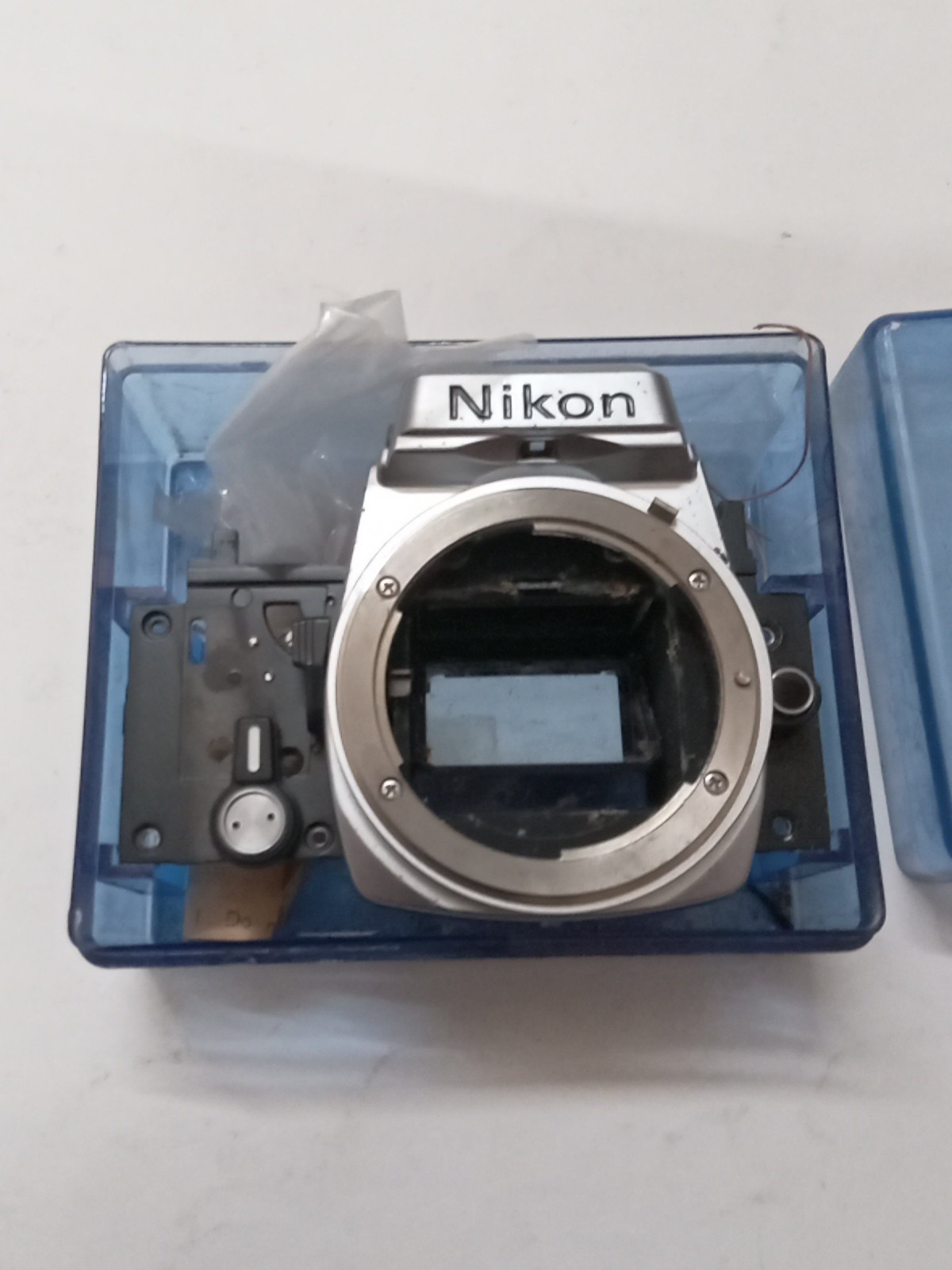 New Old Stock Nikon FM / FE Silver Front Bezel W Mirror Box Spare Part