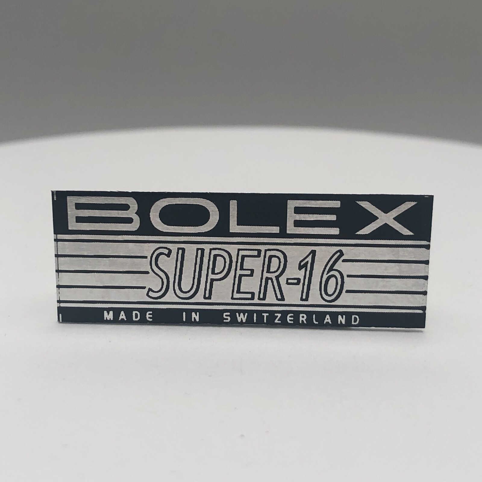BOLEX ‘SUPER-16′ LOGO PLATE BADGE’ (Glue-In) for BOLEX H16 16mm movie camera