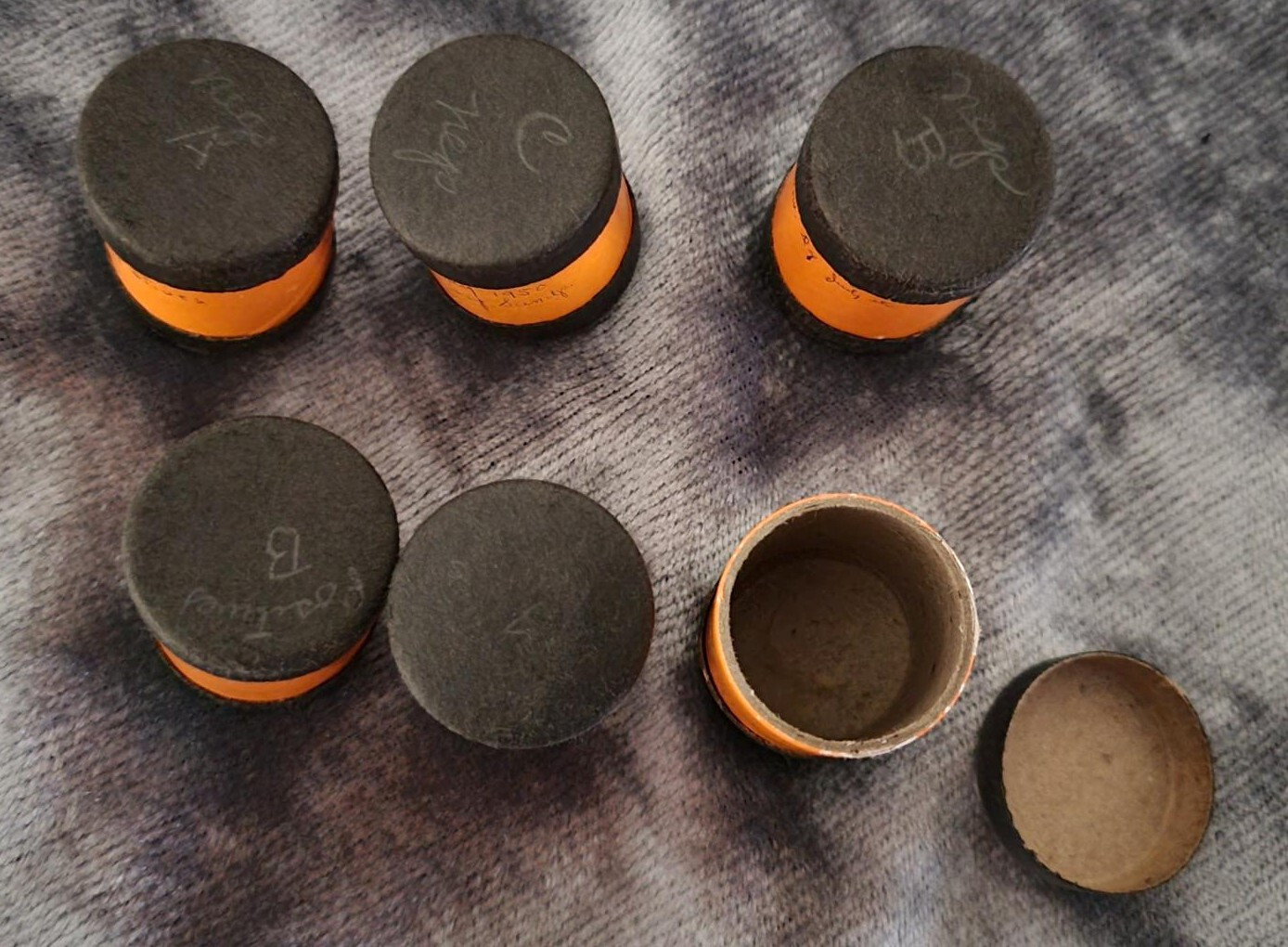 Vintage 35 mm film canisters-leather, metal and paper