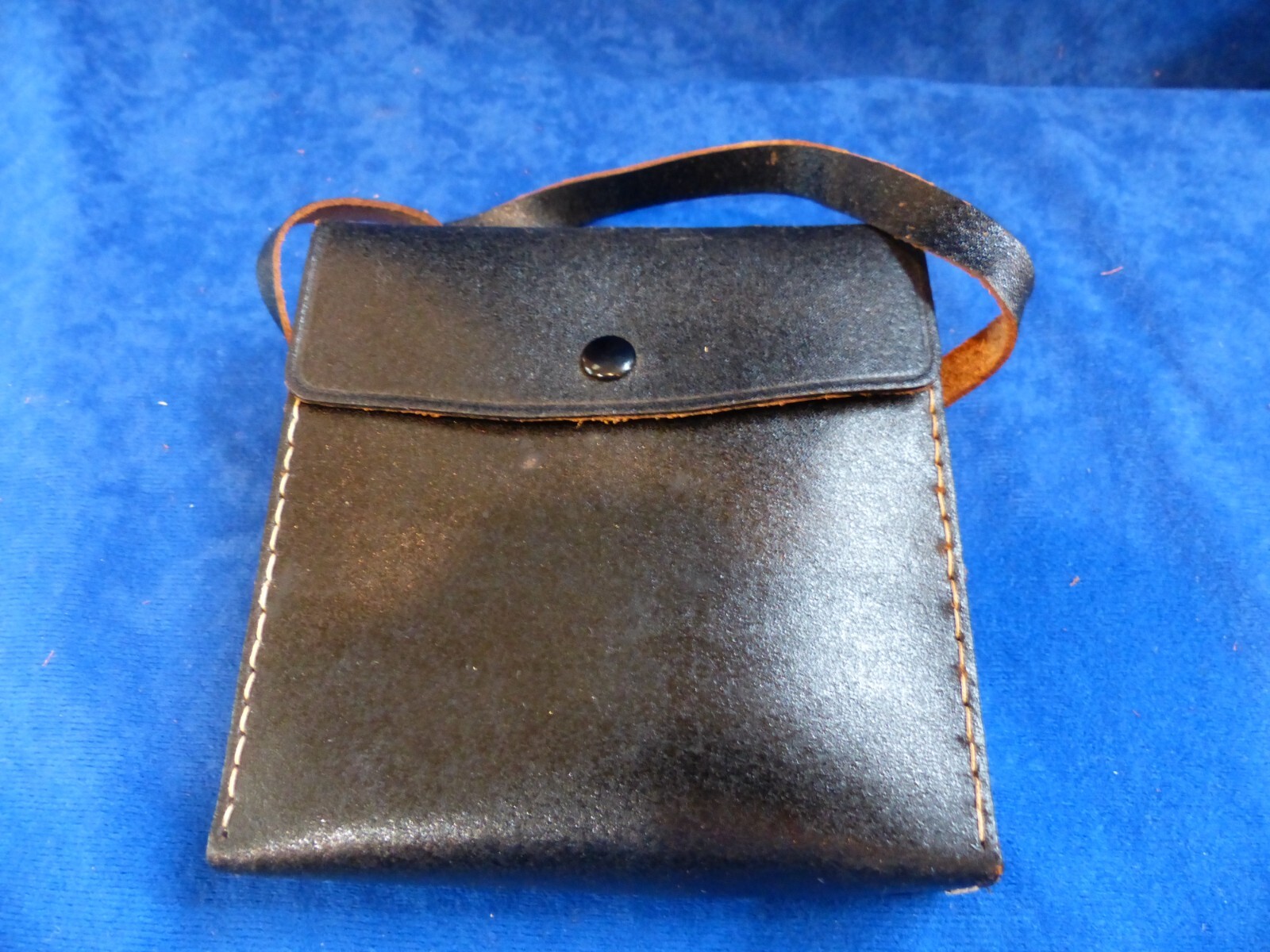 Vintage small black leather case w/ strap and metal clip, made in Japan
