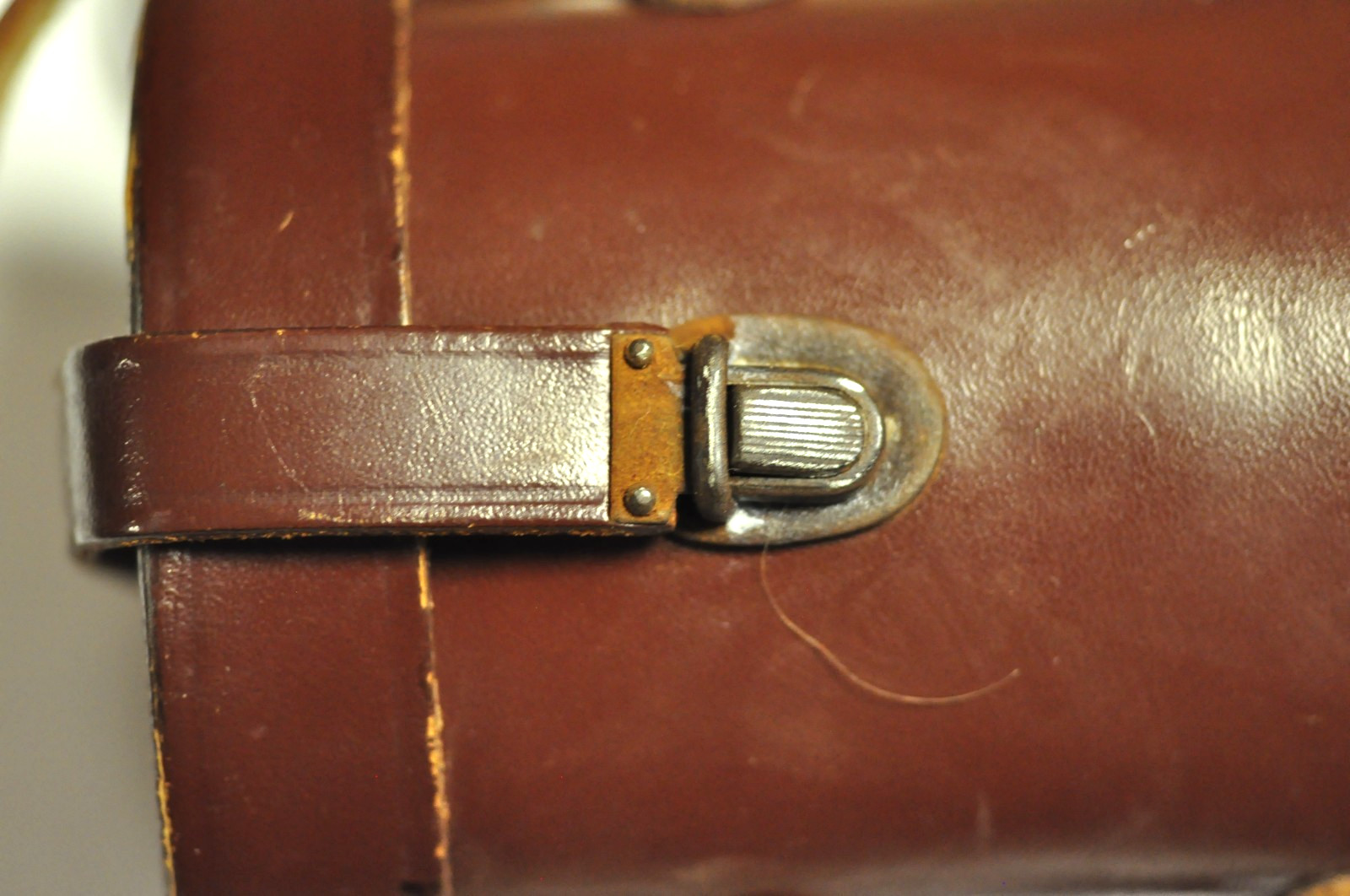 Brown leather oval lens case as shown. READ.
