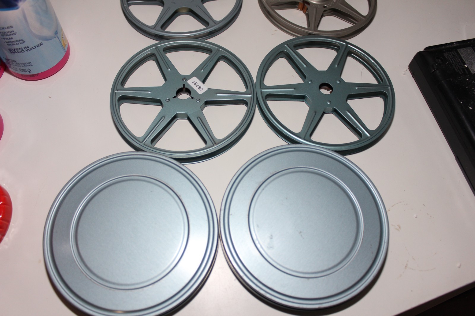 4 METAL SUPER 8 REELS WITH TINS HERALD SQUARE MACY’S W.T. GRANT B GERTZ COMPCO